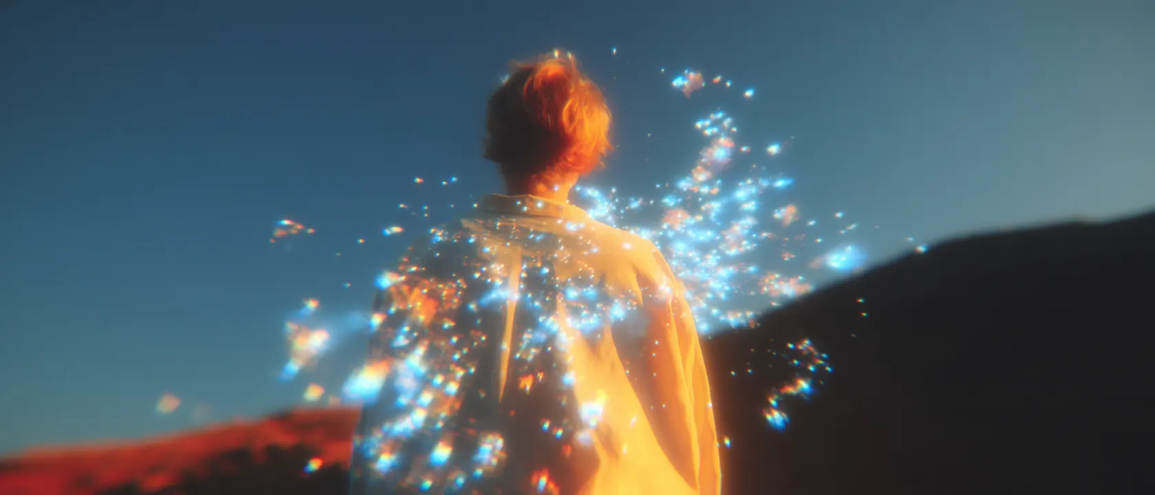 A person turning toward a burst of light